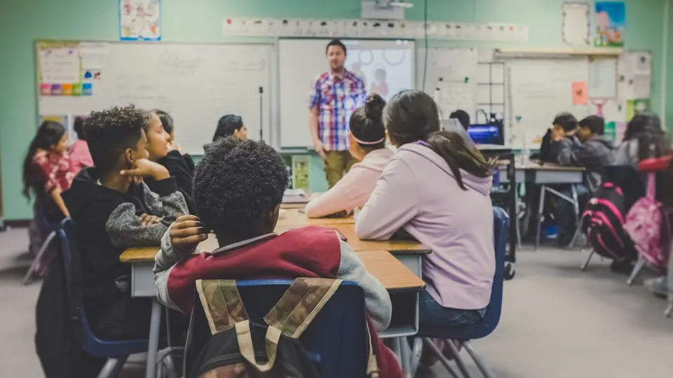 Students and a teacher in a classroom